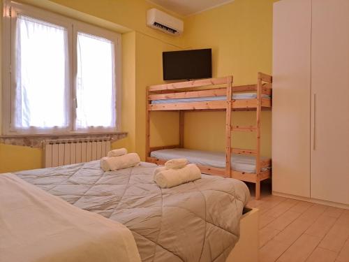 A bed or beds in a room at Appartamento Via Bixio