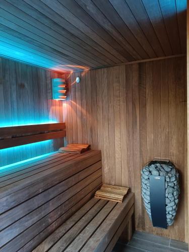 a sauna with a bench in a wooden room at Domki na polance in Horyniec Zdrój