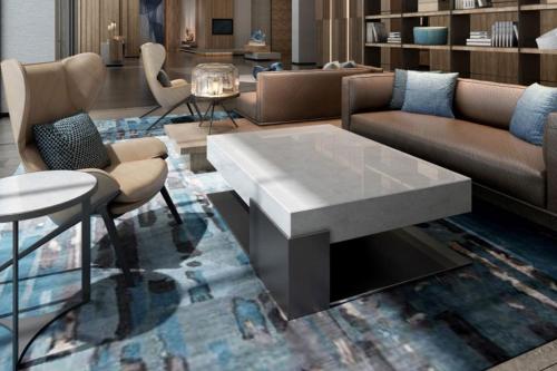 a living room with couches and a table at Fairfield by Marriott Hangzhou Qiantang in Hangzhou