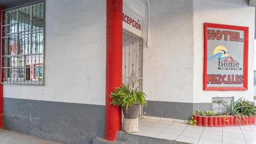 a red pole on the side of a hotel at Mezcales Inn in Mezcales