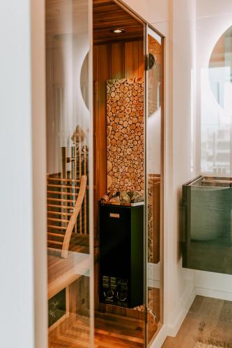a room with a wine cellar with a glass wall at Suite O in Ostend