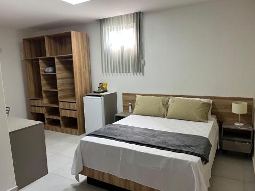 a bedroom with a large bed in a room at Tamandaré Divers Resort in Tamandaré