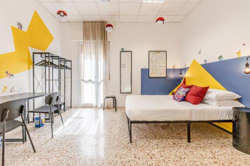 a bedroom with a bed and a table and chairs at Game Rooms Experience in Livorno