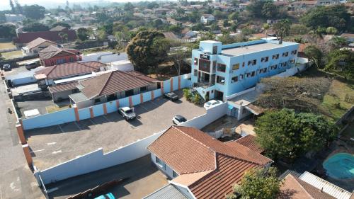 an overhead view of a white building with red roofs at The Turk Boutique Hotel in Durban