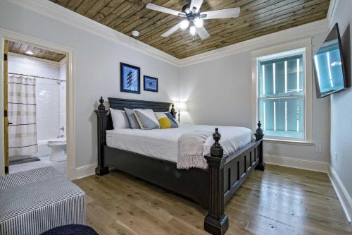 a bedroom with a bed and a ceiling fan at Cowboy at Sunset Key in Pensacola