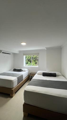Postel nebo postele na pokoji v ubytování Hotel Medellín 66