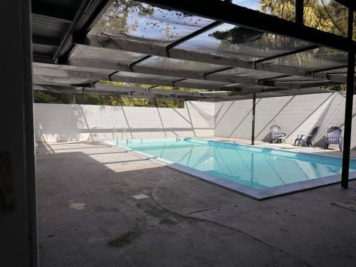 a swimming pool in a building with at The Coleman King Room in Sanford