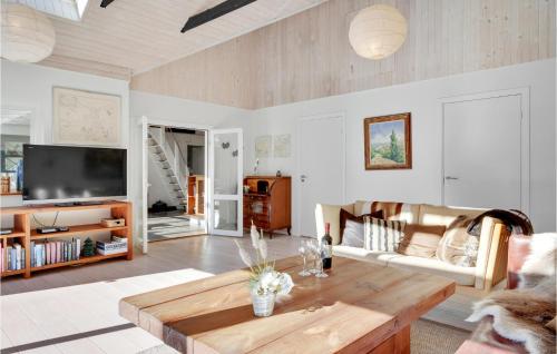 a living room with a couch and a coffee table at 3 Bedroom Gorgeous Home In Gilleleje in Gilleleje