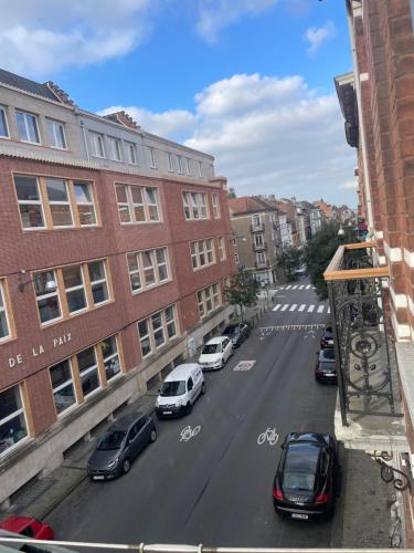 a view of a city street with cars and buildings at Attic European Quarter in Brussels