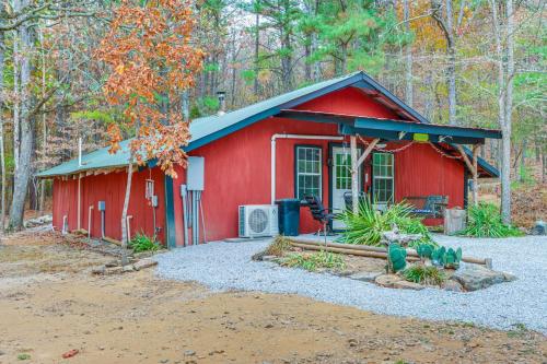 a red shed with a group of birds in front of it at Bunkhouse-Style Studio in Elkins Near ATV Trails! in Elkins
