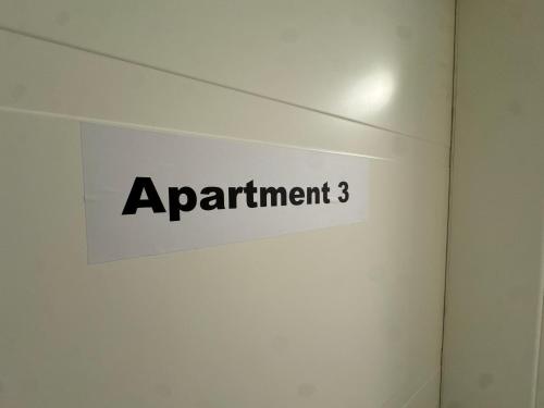 a sign that says experiment on a wall at City Apart 3 Stadtwohnung mit NETFLIX Nahe Bahnhof in Sinsheim
