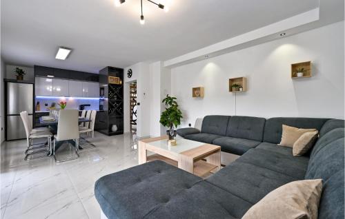 a living room with a couch and a table at Lovely Home In Vinogradi Ludbreski in Ludbreg