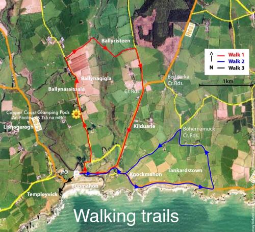 a map of walking trails with a red and blue at An Faoileán Glamping Pod in Bunmahon