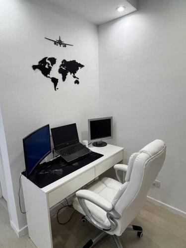 an office with a desk with a laptop and a chair at Premium Apartment in City heart in Buenos Aires