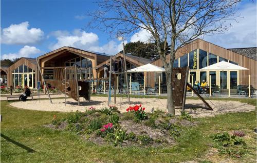 a playground in front of a building at Awesome StaCaravan In Callantsoog in Callantsoog