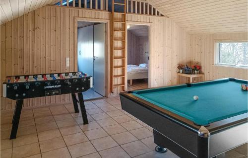 a room with a pool table and a bedroom at Pet Friendly Home In Köpingsvik in Köpingsvik