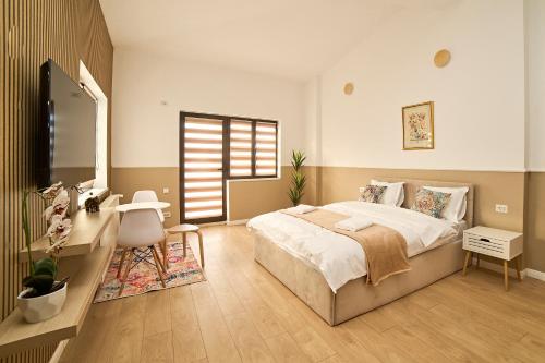 Μια τηλεόραση ή/και κέντρο ψυχαγωγίας στο Dona Premier Suites