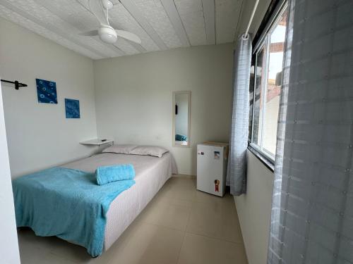 Ένα ή περισσότερα κρεβάτια σε δωμάτιο στο Hanuá Beach House