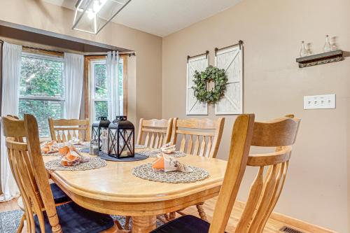 a dining room with a wooden table and chairs at Spacious Home in Helen with Porch and Balcony! in Helen