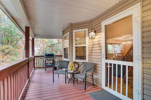 a porch of a house with chairs and a grill at Spacious Home in Helen with Porch and Balcony! in Helen