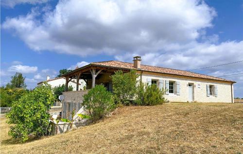 a small white house on top of a hill at 4 Bedroom Gorgeous Home In Anthé in Anthé