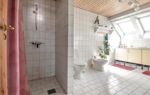a bathroom with a toilet and a shower at Holiday Home Nørre Nebel 56 in Nymindegab