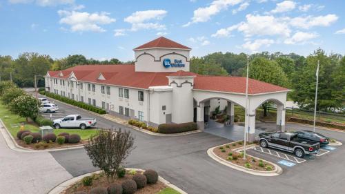 an aerial view of a hotel with a parking lot at Best Western Kernersville in Kernersville