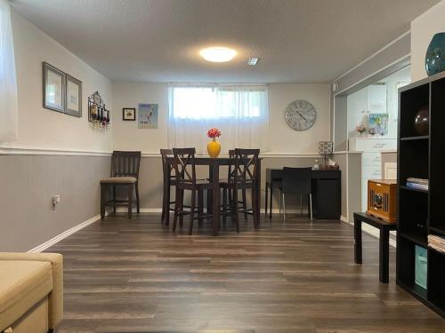 a living room with a dining room table and chairs at 2 bedroom rental apartment , 1 sofa bed, 2 car parking in Mississauga