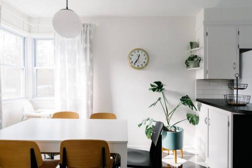 a kitchen with a white table and a clock on the wall at Cuyahoga Valley NP, Dog Friendly, Boston Mills Ski in Brecksville