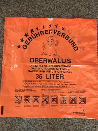 an orange bag sitting on the ground with stars at Chalet Julia mit Sauna in Eisten