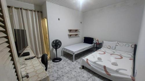 Postel nebo postele na pokoji v ubytování Will's House Hospedagem Familiar