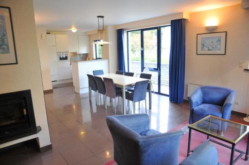 a kitchen and dining room with a table and chairs at Résidence Durbuy in Durbuy