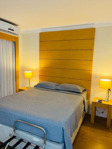 Katil atau katil-katil dalam bilik di Quarto de hotel de luxo Congonhas