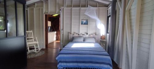 Postel nebo postele na pokoji v ubytování Coco et Cajou Bungalows