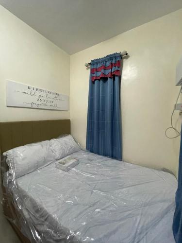 Postel nebo postele na pokoji v ubytování Staycation House in Dauis, Panglao
