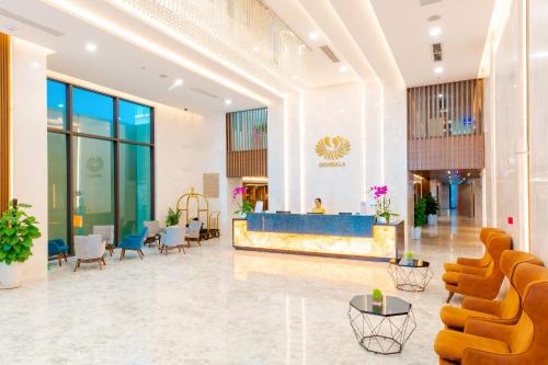 a lobby of a hotel with chairs and tables at Gonsala Hotel Nha Trang in Nha Trang