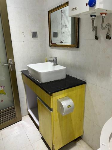 a bathroom with a sink and a toilet at Sea View Holiday House in Hong Kong