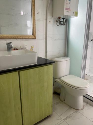 a bathroom with a sink and a toilet at Sea View Holiday House in Hong Kong