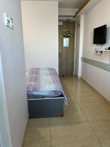 a hospital hallway with a bed in a room at Sea View Holiday House in Hong Kong