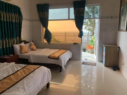 Ένα ή περισσότερα κρεβάτια σε δωμάτιο στο Thien Son Homestay - Giáp Biển
