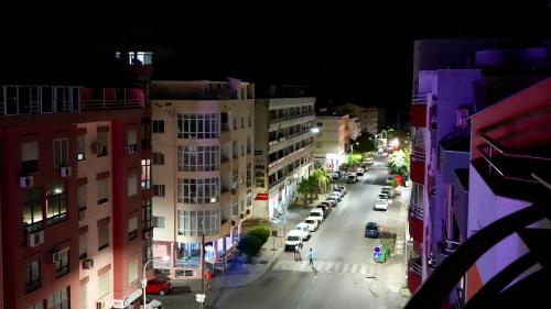 a view of a city street at night with cars at Spacious Penthouse with BBQ and Views in Praia