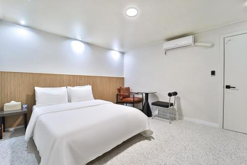Ein Bett oder Betten in einem Zimmer der Unterkunft Anyang Riviera