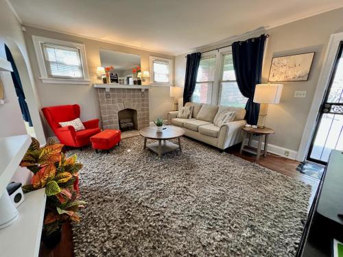 a living room with a couch and a fireplace at Comfy Cozy Bungalow Suite 2 10 min from Downtown in Cincinnati