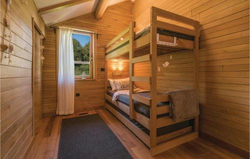 a small room with bunk beds in a cabin at Beautiful Home In Gornji Zvecaj in Gornji Zvečaj
