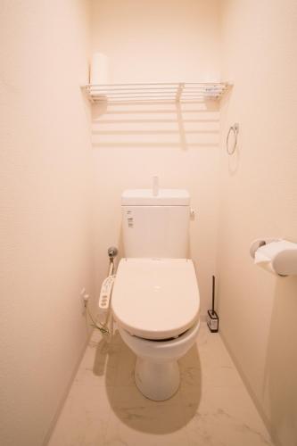 a bathroom with a white toilet in a room at LANDMARK NAMBA EBISUCHO room 901 in Osaka