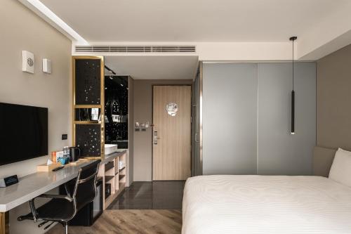 HOTEL LEISURE Kaohsiungにあるテレビまたはエンターテインメントセンター