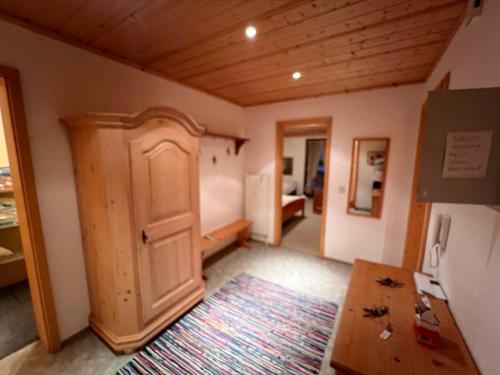 a room with an open door and a rug at Apartment 8 Grüner Baum Alpendorf in Alpendorf