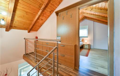 a staircase in a house with wooden ceilings at Amazing Home In Susobreg With Wifi in Jertovec