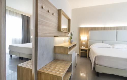 Postel nebo postele na pokoji v ubytování Hotel Meridiano