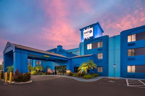 a blue building with a sign on it at SPOT X Hotel Tampa - Wesley Chapel by The Red Collection in Wesley Chapel
